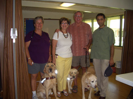 Linda, Jim, Joel, and Debbie with guide dogs